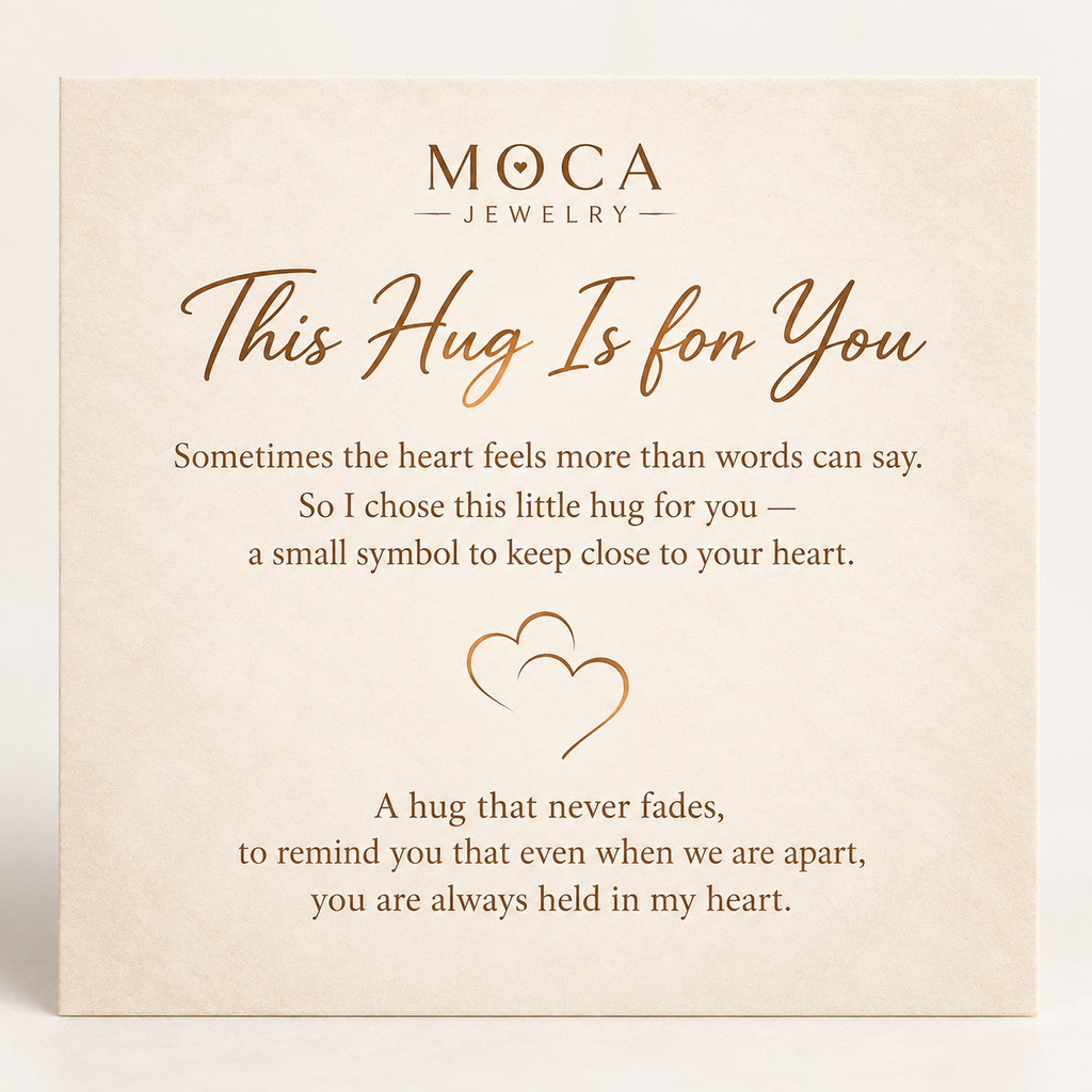 MOCA complimentary jewelry message card with a hug and heart design